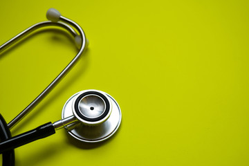 stethoscope with healthcare concept inspiration on yellow background