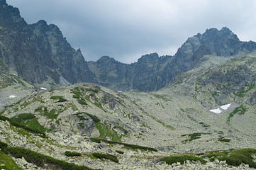 Fototapeta na wymiar Tatra Mountain peaks panorama in clouds, view from saddle Prielom. Slovakia