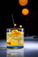 Cocktail with orange garnish