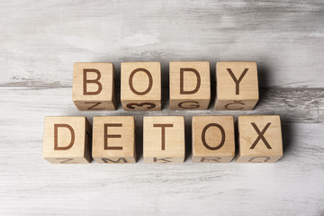 Fototapeta premium BODY DETOX text on wooden cubes on wooden background