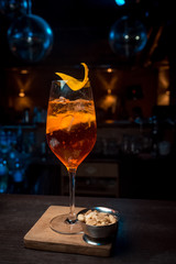 Оrange alcoholic drink in glass with ice