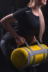 sports girl in uniform holds sports equipment