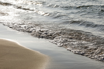 Sea waves by the beach shore