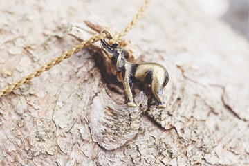 Tiny fashionable female bracelet on wooden background