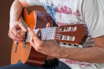 Young man play guitar