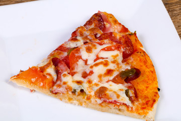 Pizza with sausages and tomato