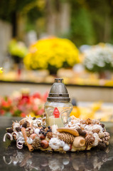 candles on grave during All Saints Day celebration