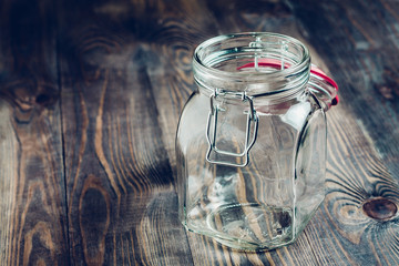 Empty glass jar on a wooden table - utensils for food