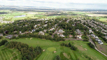 Fototapeta na wymiar Aerial view over the village of Bridge of Weir and surrounding countryside.