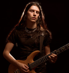 man playing electrical guitar 