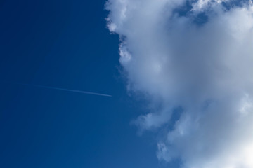 airplane and cloud in the blue sky