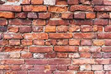 Fototapeta premium Old brick wall, old texture of red stone blocks closeup