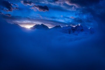 Great view of the foggy valley in Gran Paradiso National Park,  Alps, Italy,  dramatic scene, beautiful world. colourful autumn morning,scenic view with cloudy sky, majestic dawn in mountain landscape