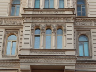 Obraz premium Fragment of the facade of the beautiful old house Muruzi in St. Petersburg, decorated with arches and oriental ornament