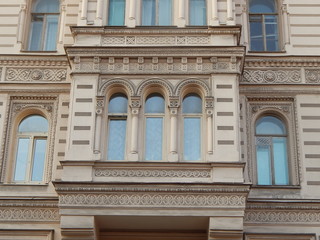 Obraz premium Fragment of the facade of the beautiful old house Muruzi in St. Petersburg, decorated with arches and oriental ornament