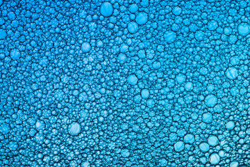 Background of oil droplets on the water surface.