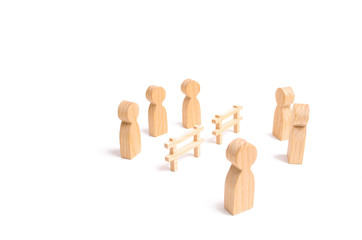 Termination and breakdown of relations, breaking ties. Contract break, conflict of interests. Negotiations of businessmen. A wooden fence divides the two groups discussing the case.