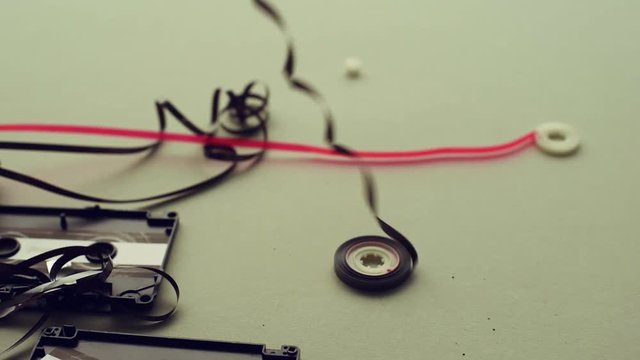 Damaged audio cassette with tangled tape, obsolete retro technology concept