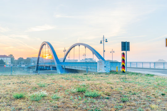 View of border bridge between Poland and Germany. Sunrise view of bridge from Frankfurt Oder in German.