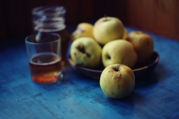 apple juice over summer nature background