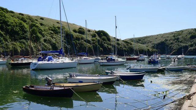 Small rowing boats and other sailing craft moored in Solva Harbour Pembrokeshire