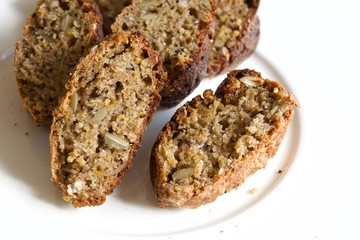 Tasty buckwheat bread on the white plate.