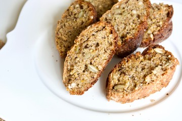 Tasty buckwheat bread on the white plate.