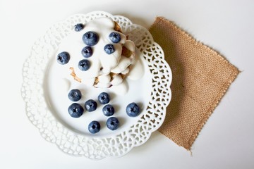 Obraz na płótnie Canvas Tasty blueberry pancakes with coconut dipping.