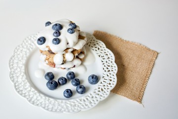 Obraz na płótnie Canvas Tasty blueberry pancakes with coconut dipping.