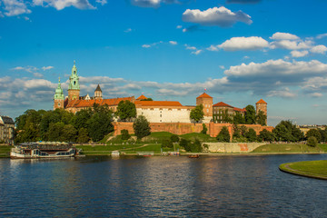 buildings and landmarks concept of old castle architecture complex near river waterfront city district in contrast colorful bright day weather time