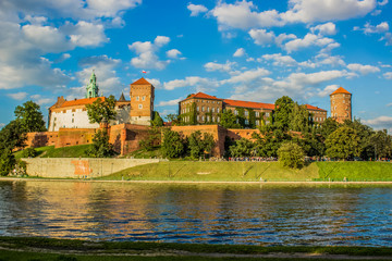 buildings and landmarks concept of old castle architecture complex near river waterfront city district in contrast colorful bright day weather time