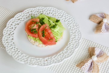 Tasty avocado rice cake on the white plate.