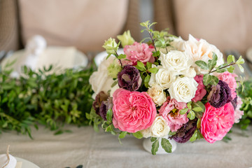 Wedding Banquet or gala dinner. The chairs and table for guests, served with cutlery and crockery. Covered with a linen tablecloth runner. party on terrace