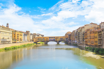 Obraz premium Beautiful view of the Ponte Vecchio bridge across the Arno River in Florence, Italy