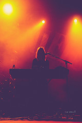 Silhouette of a female musician in a red background