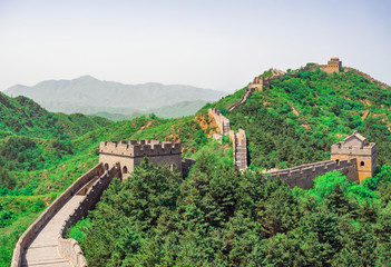 Fototapeta na wymiar The Great Wall Jinshanling section with green trees in a sunny day, Beijing, China