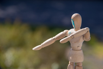 Wooden art mannequin closeup summer sunshine, np people.