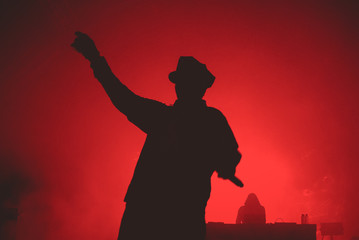 Silhouette of a musician in a red background