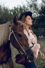 Foto op Canvas girl in cowboy black hat shirt jeans with horse © Air_Lady