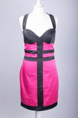 Tailors Mannequin dressed in a Pink and Black Satin Dress