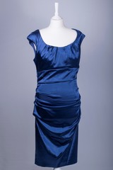 Tailors Mannequin dressed in a Blue Satin Dress