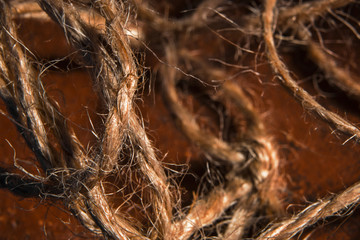 Jute rope on a brown background is macro