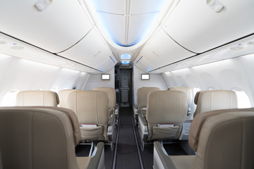 Empty passenger airplane seats in cabin. Interior in modern airplane..