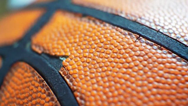 surface of an old basketball ball close-up.