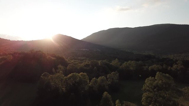 aerial view of forest and shining sun in Pyrenees, Aude in southern of France
