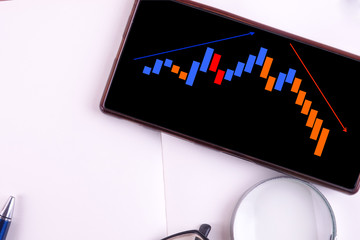  Forex trading chart on a smartphone . Business and finance concept