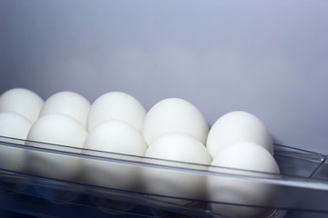 White chiken eggs in the fridge