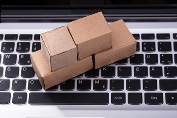 Cardboard Boxes On Laptop Keypad