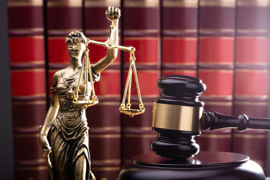 Brown Gavel With Statue Of Justice
