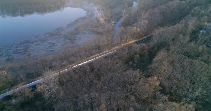 Aerial Pan Around of a Train Passing Through Westchester New York